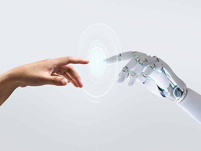 human hand reaching out and touching a robot hand